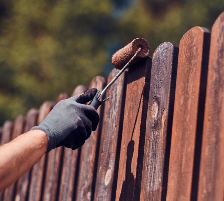man working the fence in hamilton